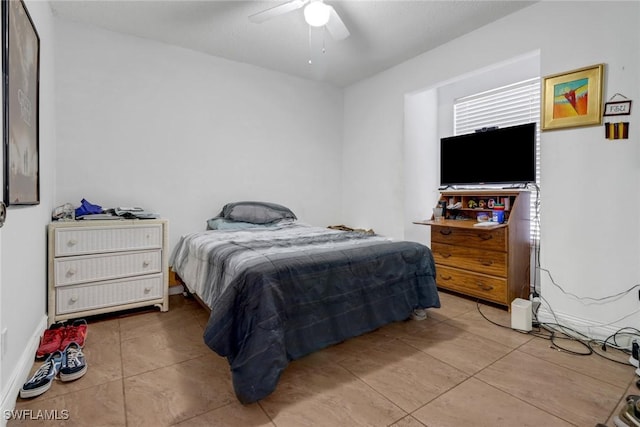 4617 Lombardy Ln, Naples, FL 34112 - bedroom with tile patterned flooring and a ceiling fan