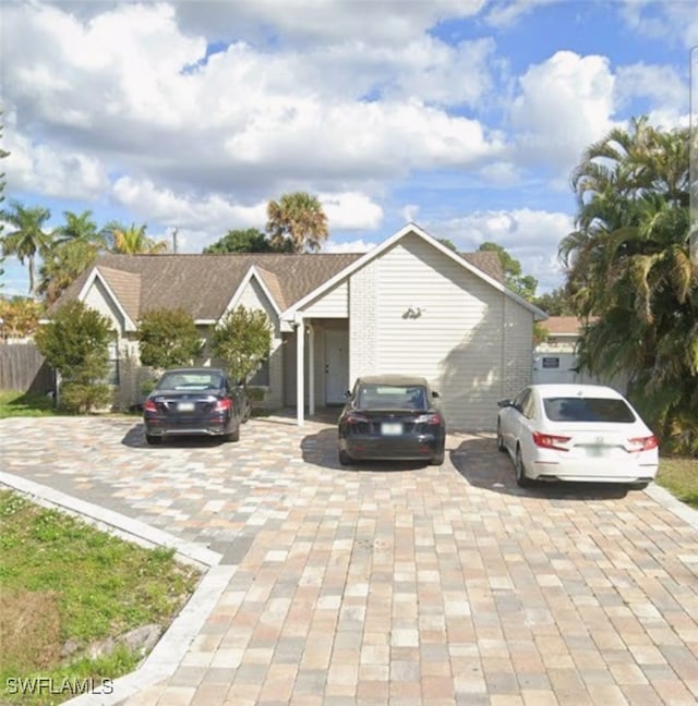 4617 Lombardy Ln, Naples, FL 34112 - view of front of home with decorative driveway
