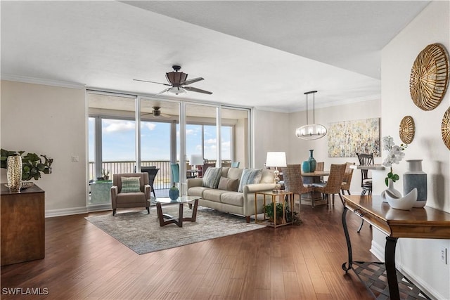 12701 Mastique Beach Blvd Unit 603, Fort Myers, FL 33908 - living room featuring ceiling fan, dark wood-type flooring, baseboards, a chandelier, and ornamental molding