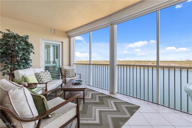 12701 Mastique Beach Blvd Unit 603, Fort Myers, FL 33908 - sunroom / solarium featuring a water view and an outdoor living space