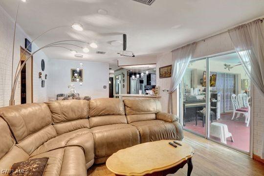 5251 Boxwood Way, Naples, FL 34116 - living room with light wood-type flooring