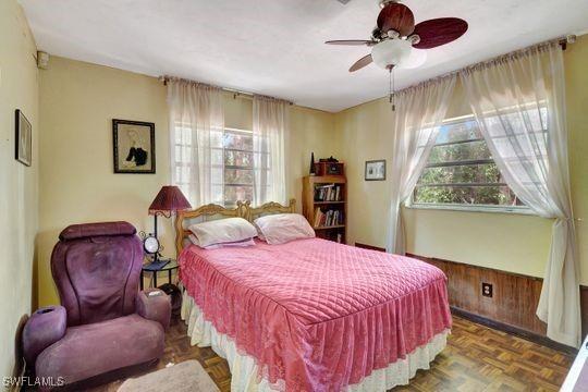 5251 Boxwood Way, Naples, FL 34116 - bedroom featuring a ceiling fan