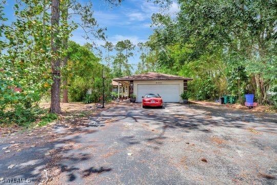 5251 Boxwood Way, Naples, FL 34116 - view of front of house featuring driveway