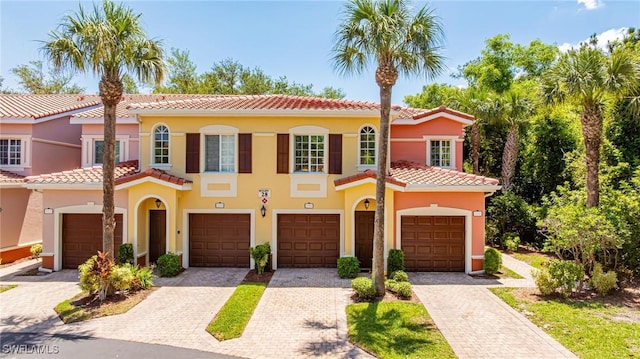 20273 Royal Villagio Ct Unit 204, Estero, FL 33928 - view of front of home featuring a tile roof, stucco siding, and driveway