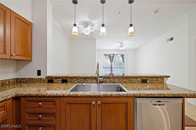 20273 Royal Villagio Ct Unit 204, Estero, FL 33928 - kitchen with stainless steel dishwasher, a sink, brown cabinetry, a ceiling fan, and dark stone countertops