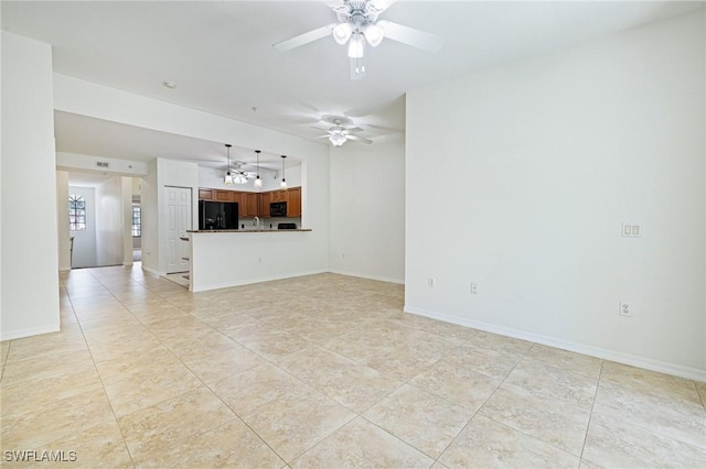 20273 Royal Villagio Ct Unit 204, Estero, FL 33928 - unfurnished living room featuring light tile patterned floors, ceiling fan, and baseboards