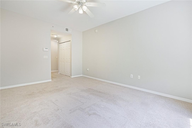 20273 Royal Villagio Ct Unit 204, Estero, FL 33928 - unfurnished room with ceiling fan, light carpet, and baseboards