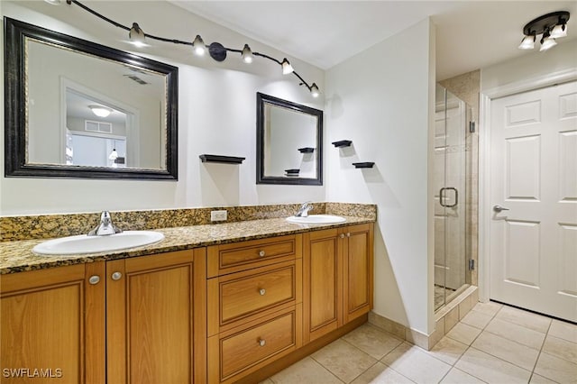 20273 Royal Villagio Ct Unit 204, Estero, FL 33928 - bathroom with tile patterned flooring, a shower stall, and double vanity