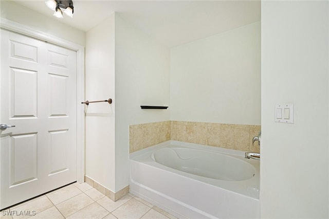 20273 Royal Villagio Ct Unit 204, Estero, FL 33928 - bathroom featuring tile patterned flooring, a garden tub, and baseboards