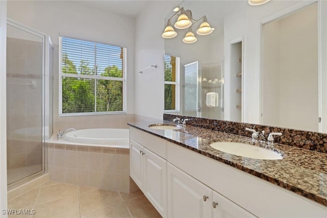 full bathroom with a stall shower, tile patterned floors, a garden tub, and double vanity