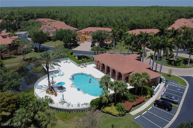 bird's eye view of a forest and a pool area