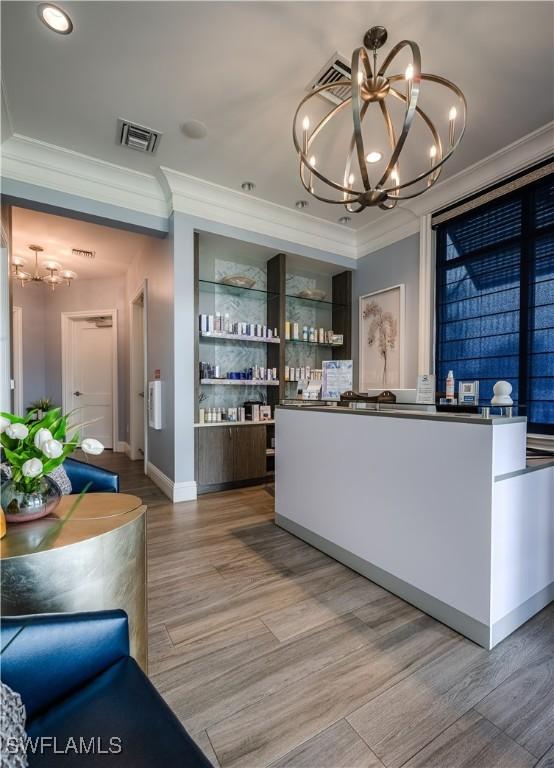 5416 Double Eagle Cir Unit 2327, Ave Maria, FL 34142 - reception area featuring a chandelier, ornamental molding, and recessed lighting