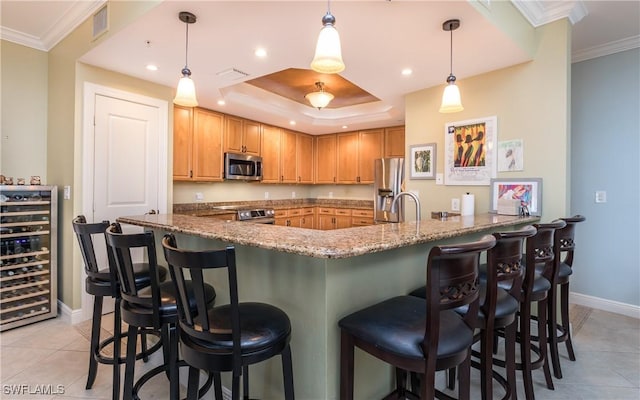 5704 Cape Harbour Dr Unit 105, Cape Coral, FL 33914 - kitchen featuring appliances with stainless steel finishes, beverage cooler, baseboards, light tile patterned floors, and crown molding