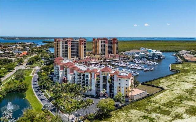 5704 Cape Harbour Dr Unit 105, Cape Coral, FL 33914 - drone / aerial view of a nearby body of water, numerous boat docks, and apartment complex / building