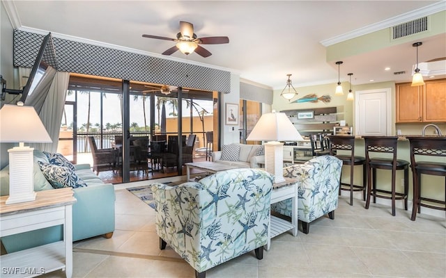 5704 Cape Harbour Dr Unit 105, Cape Coral, FL 33914 - living area with crown molding, light tile patterned flooring, and ceiling fan