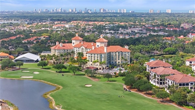 2728 Tiburon Blvd E Unit A104, Naples, FL 34109 - bird's eye view of a nearby body of water, a golf club, and a view of skyline