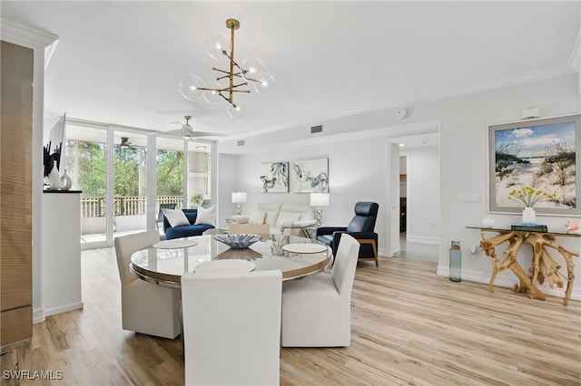 2728 Tiburon Blvd E Unit A104, Naples, FL 34109 - dining area with light wood-style flooring, a chandelier, baseboards, ornamental molding, and a ceiling fan