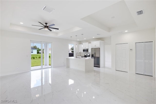 2809 54th St W, Lehigh Acres, FL 33971 - unfurnished living room with a tray ceiling, a ceiling fan, light marble finish flooring, recessed lighting, and a sink