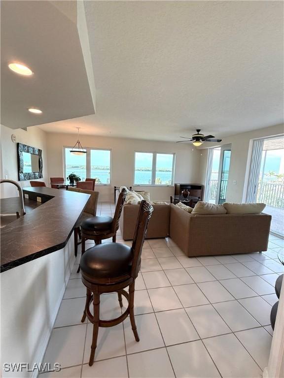 8751 Estero Blvd W Unit 304, Bonita Springs, FL 33931 - living area featuring ceiling fan, light tile patterned flooring, and recessed lighting