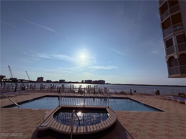 8751 Estero Blvd W Unit 304, Bonita Springs, FL 33931 - community pool featuring a patio area