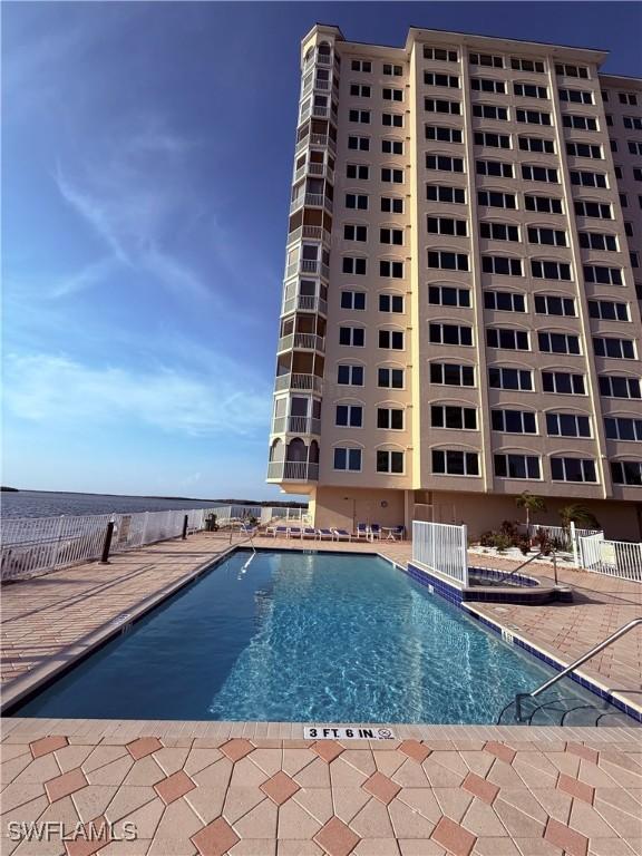 8751 Estero Blvd W Unit 304, Bonita Springs, FL 33931 - community pool featuring a patio area