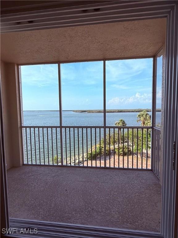 8751 Estero Blvd W Unit 304, Bonita Springs, FL 33931 - unfurnished sunroom with a water view
