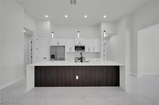 373 El Dorado Blvd S, Cape Coral, FL 33991 - kitchen featuring stainless steel appliances, a large island, white cabinets, light marble finish flooring, and recessed lighting