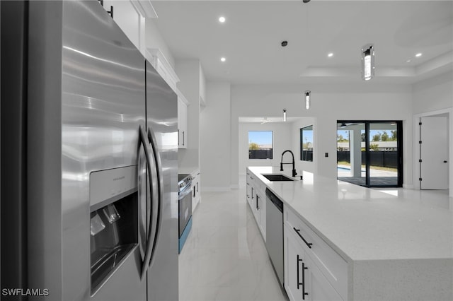 373 El Dorado Blvd S, Cape Coral, FL 33991 - kitchen featuring stainless steel appliances, a sink, white cabinetry, recessed lighting, and a large island with sink