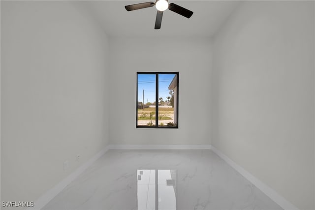 373 El Dorado Blvd S, Cape Coral, FL 33991 - empty room featuring light marble finish floors, a ceiling fan, and baseboards
