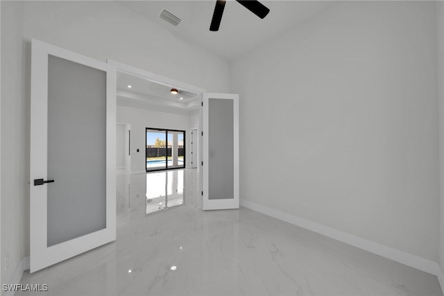 373 El Dorado Blvd S, Cape Coral, FL 33991 - unfurnished room featuring marble tiled flooring, a ceiling fan, and baseboards