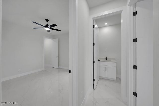 373 El Dorado Blvd S, Cape Coral, FL 33991 - corridor with light marble finish floors, a sink, baseboards, and recessed lighting