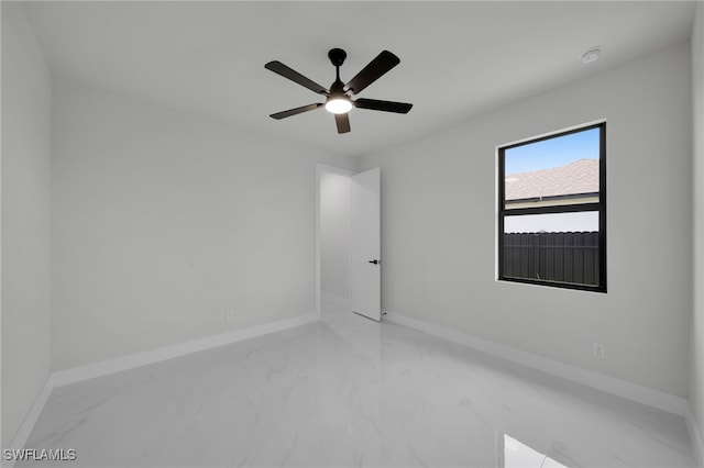 373 El Dorado Blvd S, Cape Coral, FL 33991 - unfurnished room featuring marble finish floors, baseboards, and a ceiling fan