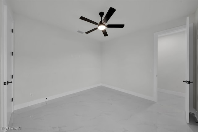 373 El Dorado Blvd S, Cape Coral, FL 33991 - empty room featuring marble finish floors, a ceiling fan, and baseboards