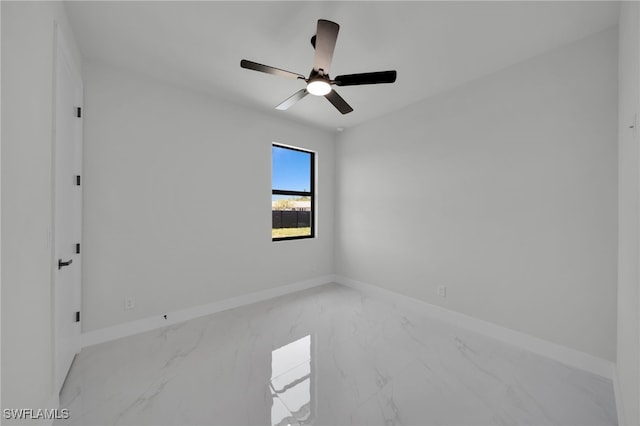 373 El Dorado Blvd S, Cape Coral, FL 33991 - unfurnished room featuring marble look tiles, baseboards, and a ceiling fan