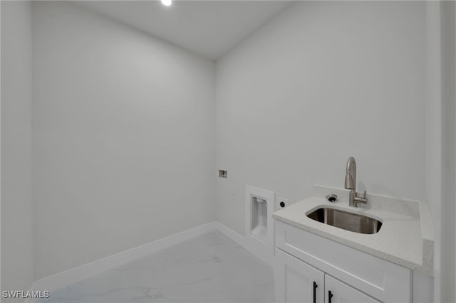 373 El Dorado Blvd S, Cape Coral, FL 33991 - laundry room with cabinet space, electric dryer hookup, light marble finish flooring, hookup for a washing machine, and baseboards