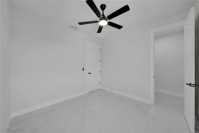 373 El Dorado Blvd S, Cape Coral, FL 33991 - spare room with light marble finish floors, baseboards, and ceiling fan