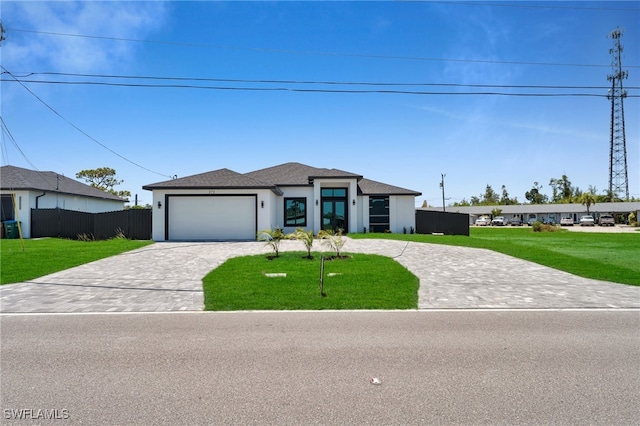 373 El Dorado Blvd S, Cape Coral, FL 33991 - view of front of home featuring decorative driveway, a garage, and stucco siding
