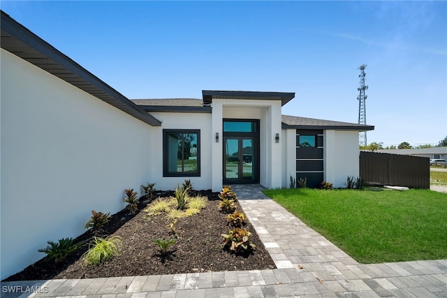 373 El Dorado Blvd S, Cape Coral, FL 33991 - entrance to property with stucco siding and french doors