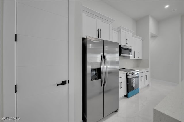373 El Dorado Blvd S, Cape Coral, FL 33991 - kitchen with stainless steel appliances, white cabinetry, light marble finish flooring, recessed lighting, and tasteful backsplash