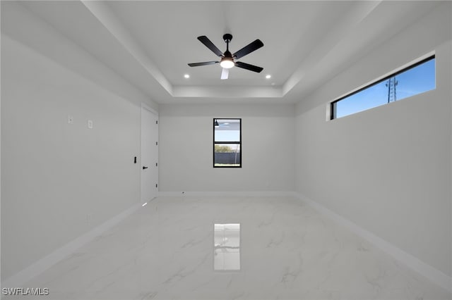 373 El Dorado Blvd S, Cape Coral, FL 33991 - spare room with marble finish floors, baseboards, a raised ceiling, recessed lighting, and ceiling fan