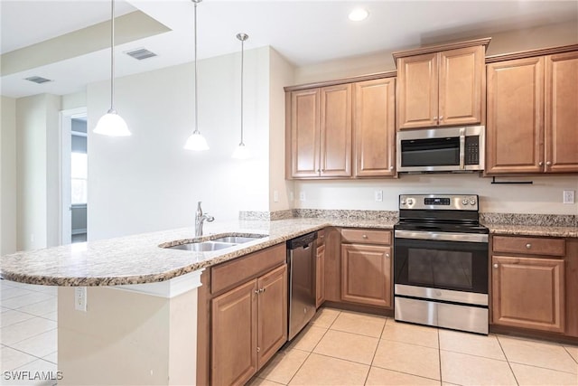 3905 Dunnster Ct, Fort Myers, FL 33916 - kitchen with stainless steel appliances, a sink, light tile patterned floors, a peninsula, and recessed lighting