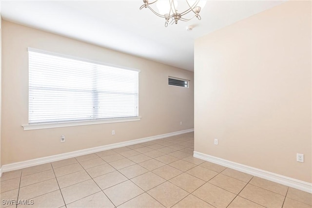 3905 Dunnster Ct, Fort Myers, FL 33916 - spare room with a chandelier, baseboards, and light tile patterned flooring