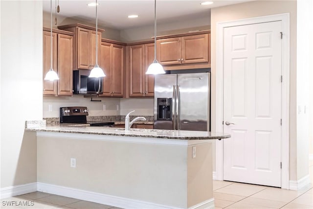 3905 Dunnster Ct, Fort Myers, FL 33916 - kitchen with appliances with stainless steel finishes, light stone counters, light tile patterned flooring, a peninsula, and baseboards