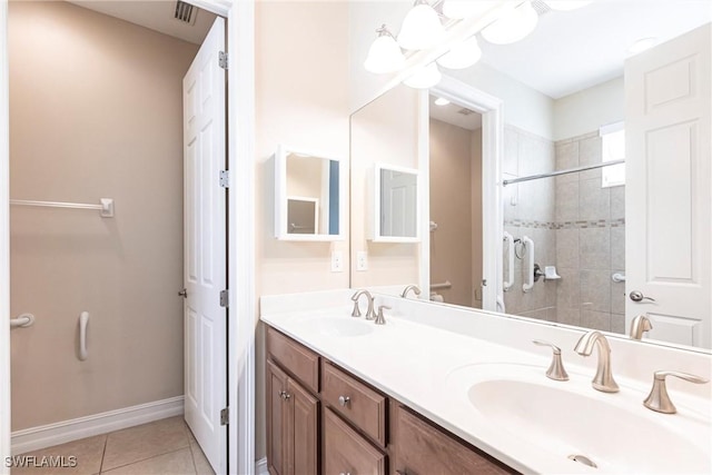3905 Dunnster Ct, Fort Myers, FL 33916 - bathroom with double vanity, tile patterned floors, tiled shower, and baseboards