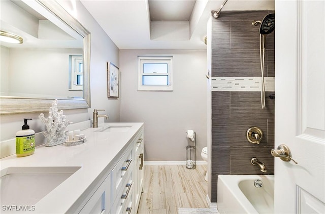 305 SW 8th St, Cape Coral, FL 33991 - full bathroom with toilet, baseboards, double vanity, and  shower combination