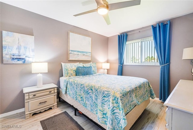 305 SW 8th St, Cape Coral, FL 33991 - bedroom with light wood-style flooring, baseboards, and a ceiling fan