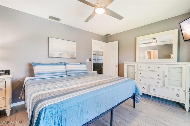 305 SW 8th St, Cape Coral, FL 33991 - bedroom with light wood finished floors and ceiling fan