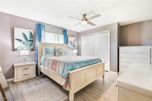 305 SW 8th St, Cape Coral, FL 33991 - bedroom featuring a closet, light wood-style floors, baseboards, and ceiling fan