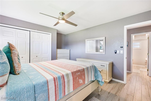 305 SW 8th St, Cape Coral, FL 33991 - bedroom featuring light wood finished floors, a closet, baseboards, and ceiling fan