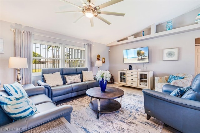 305 SW 8th St, Cape Coral, FL 33991 - living room with ceiling fan, wood finished floors, and vaulted ceiling